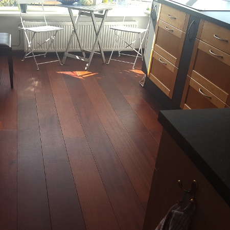 Living room with natural red wood floors